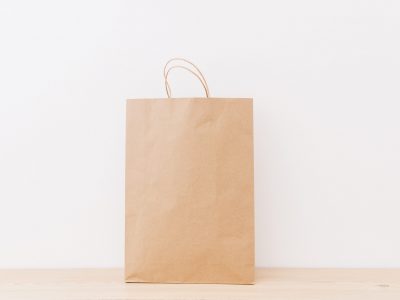 brown-shopping-bag-wooden-surface